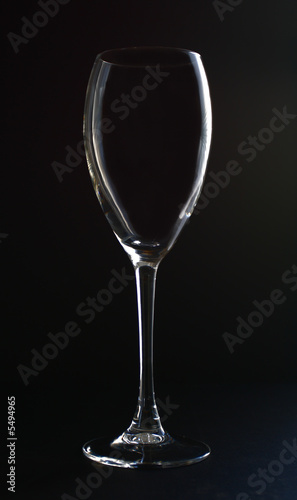 Empty glass on black back