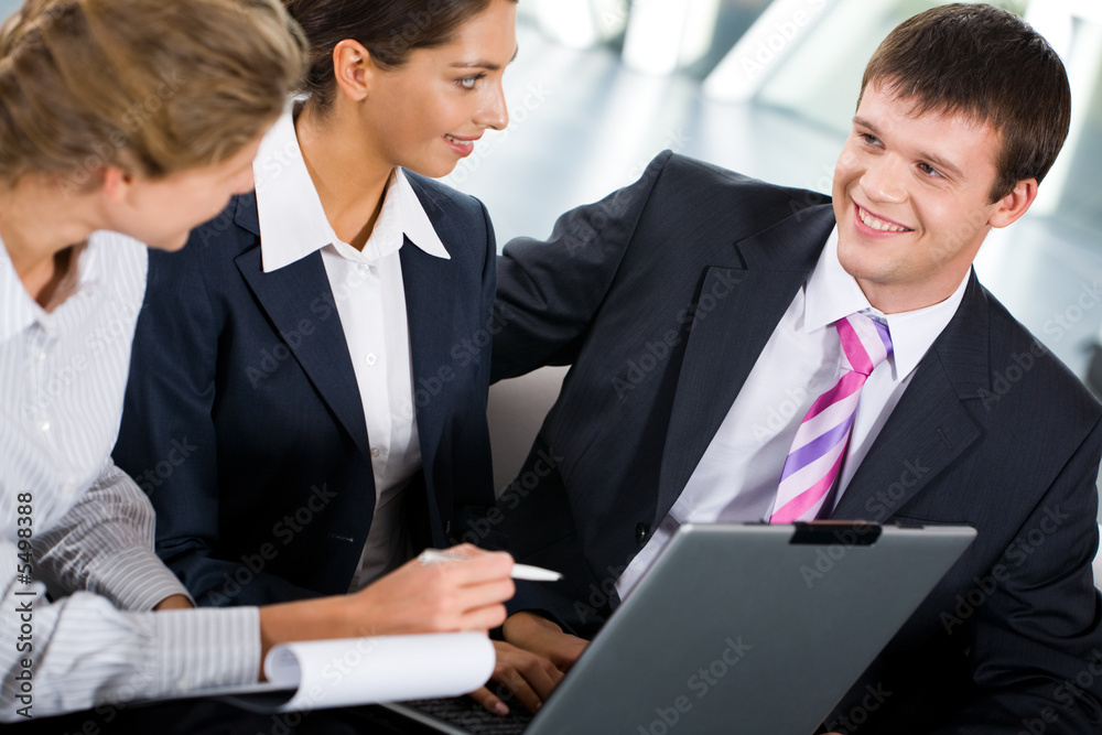 Portrait of three confident people discussing a new ideas Portrait of three confident people discussing a new ideas