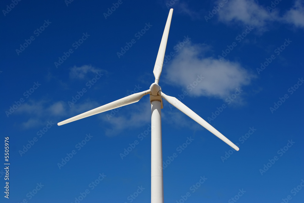 wind mill power generator against blue sky wind mill power generator against blue sky