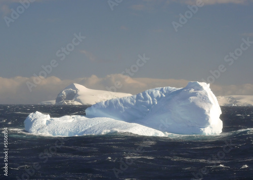 icebergs in a stormy sea in antarctica.