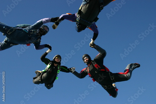 Skydivers form a formation