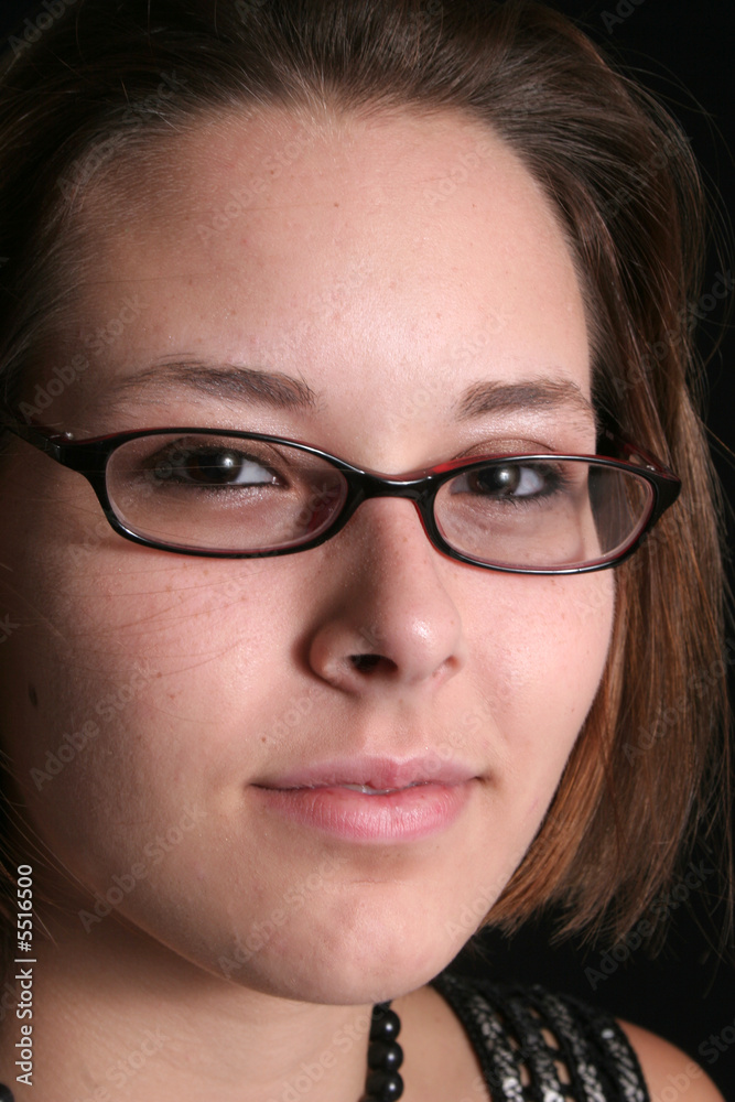 Woman in glasses with a smirk