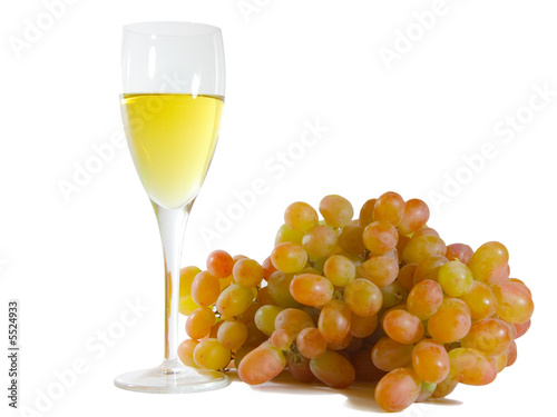 Glass of white wine and grapes isolated on white