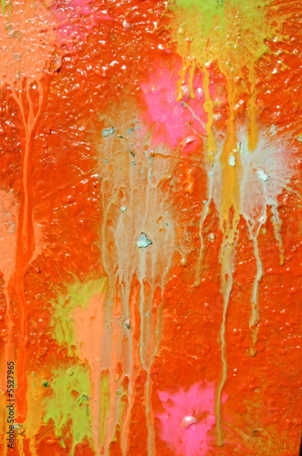 Multicolored blots and stains on wooden surface