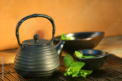 Japanese teapot and cup with mint tea