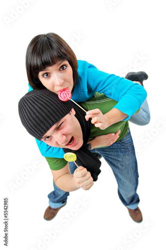 A girl and a boy with lollipops isolated on white background
