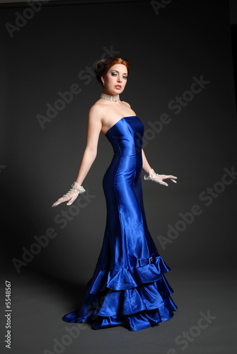 Beautiful woman in sexy blue dress