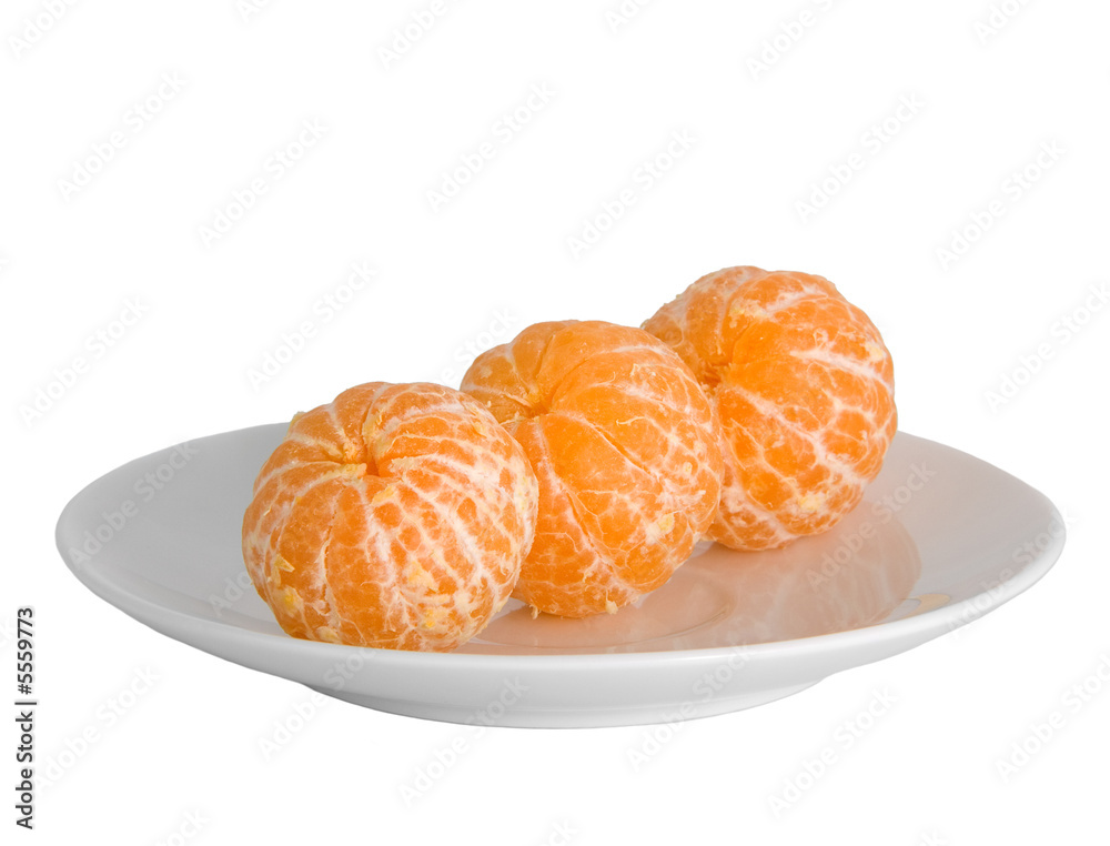 Peeled tangerines on plate isolated on white Peeled tangerines on plate isolated on white