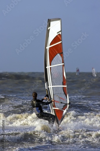 Windsurfing on a wild north sea in the Netherlands