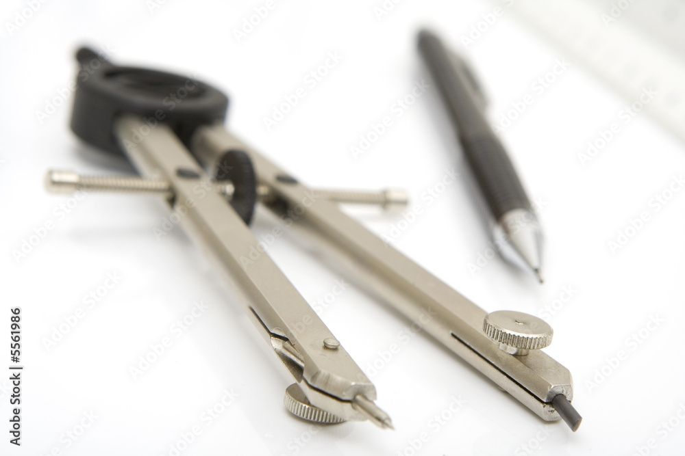 pencil and compass isolated against white background pencil and compass isolated against white background