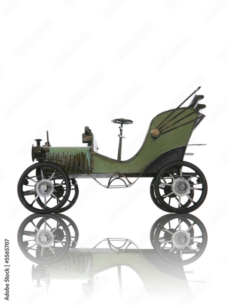 Fototapeta premium An old antique car over a white background