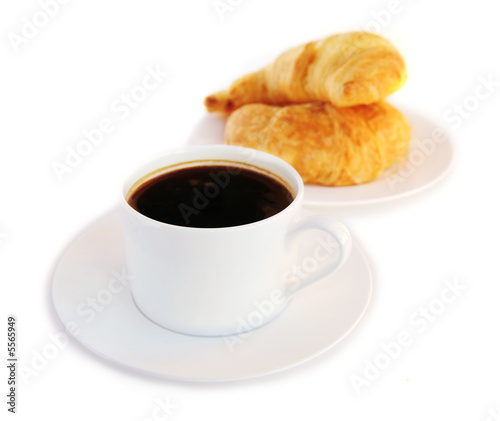Breakfast of black coffee and fresh croissants 