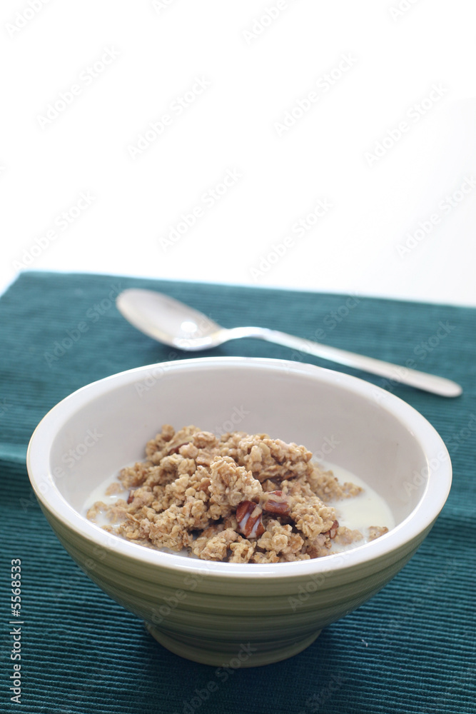 Bowl of crumbly wheat and corn cereal with nutty bits Bowl of crumbly wheat and corn cereal with nutty bits