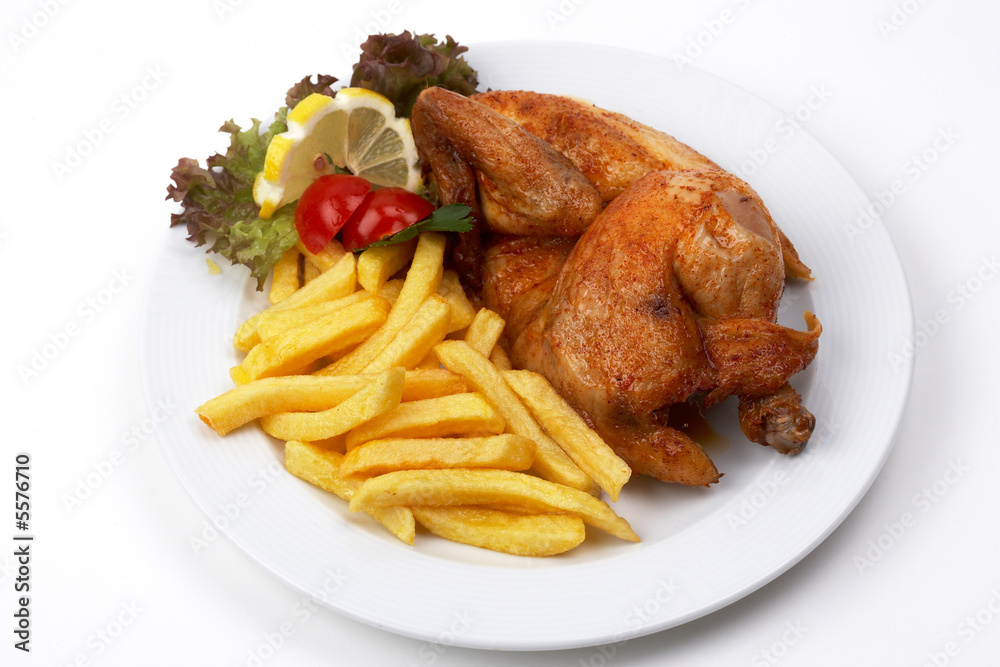 halbes Hähnchen mit Pommes StockFoto Adobe Stock