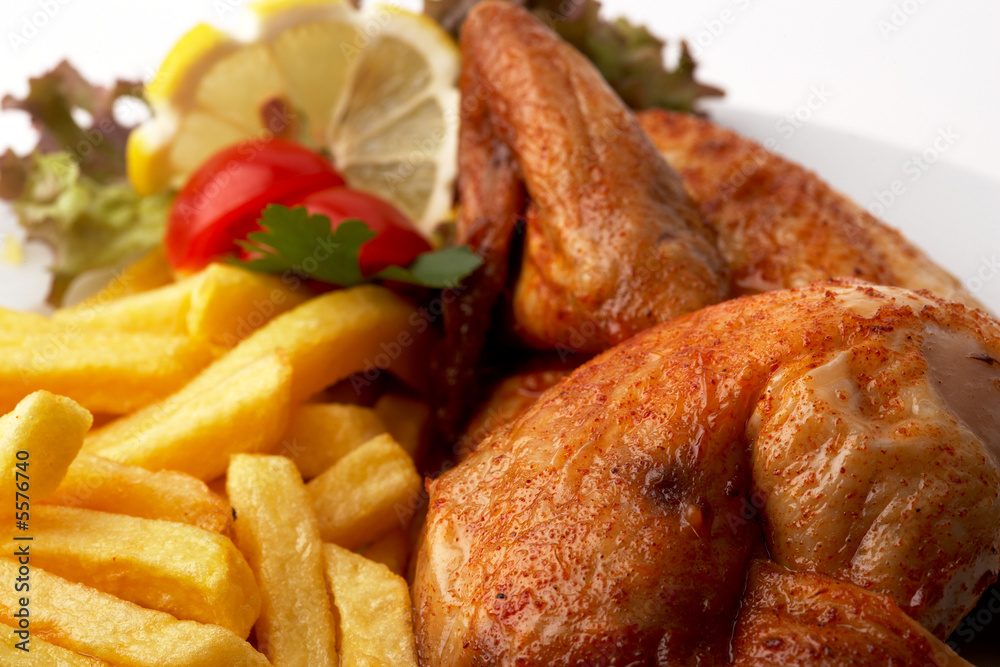 halbes Hähnchen mit Pommes StockFoto Adobe Stock halbes Hähnchen mit Pommes StockFoto Adobe Stock
