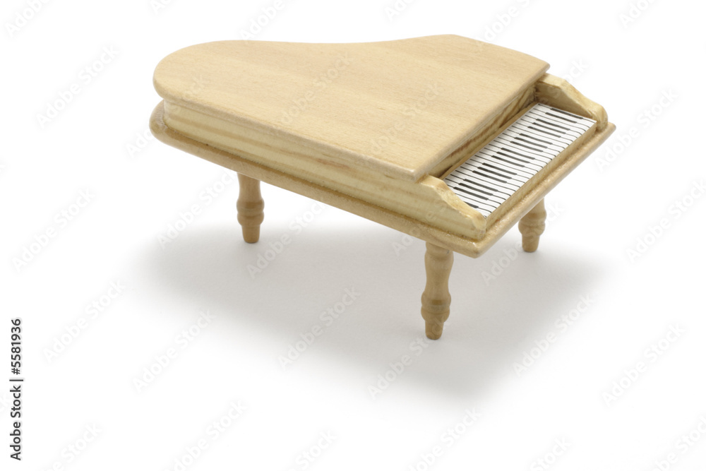 Miniature Piano on White Background