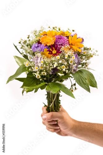 bunch of flowers in the man`s hand © AGphotographer