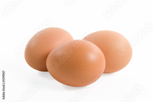 Three eggs isolated on a white background.