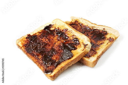 Vegemite on toast, an Australian icon.  Isolated on white. photo
