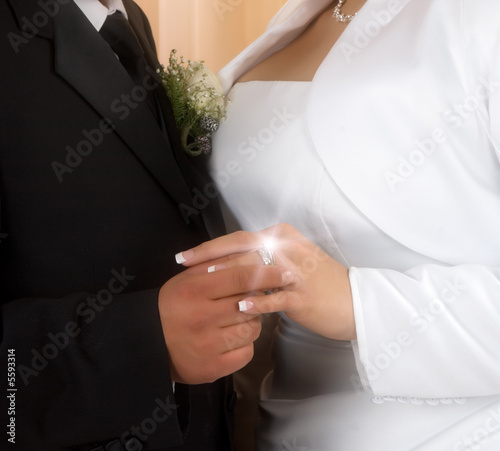 Wedding vows sealed with a ring ( a diamond is forever) photo