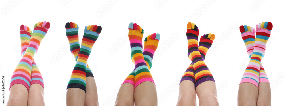 Five women with colorful rainbow striped socks Five women with colorful rainbow striped socks