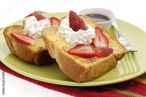 Delicious french toast with strawberries and whipped cream.