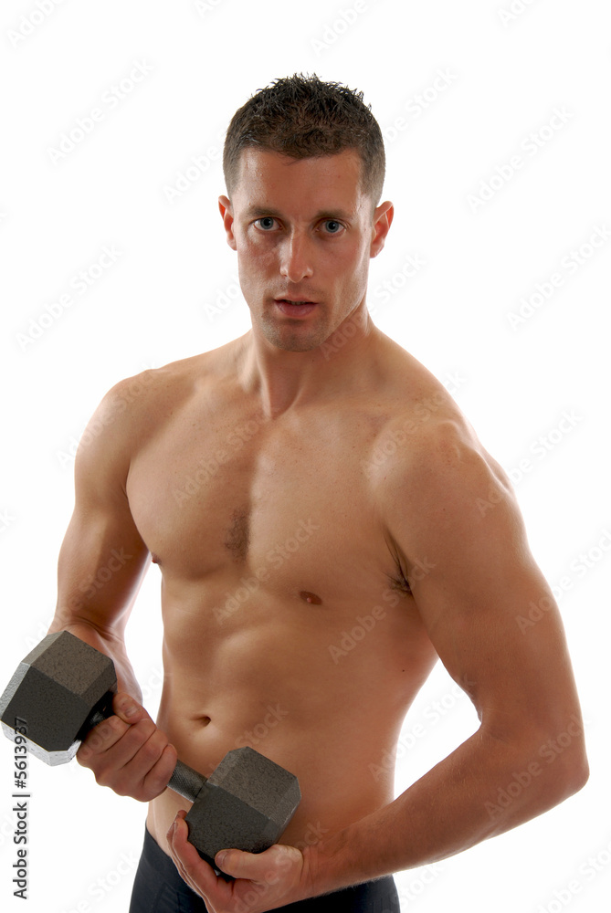 Fototapeta premium A muscular fit man lifting dumbells