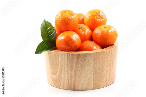 bowl of fresh tangerines isolated on white