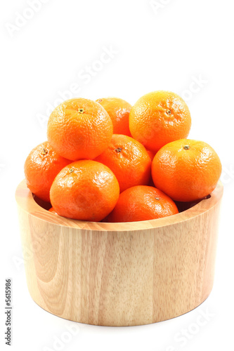 bowl of fresh tangerines isolated on white