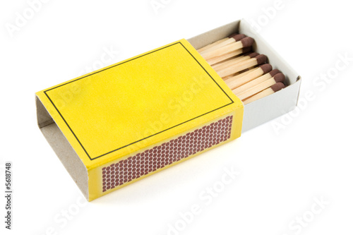 Matches in a matchbox on a white background with copy space