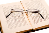 Reading - glasses on an open book  