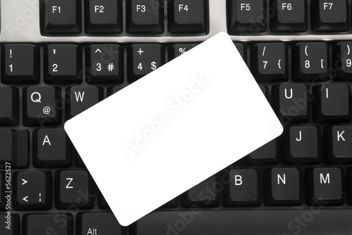 blank business card  on keyboard