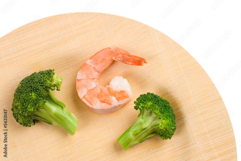 A Shrimp and two Broccoli florets bamboo plate A Shrimp and two Broccoli florets bamboo plate
