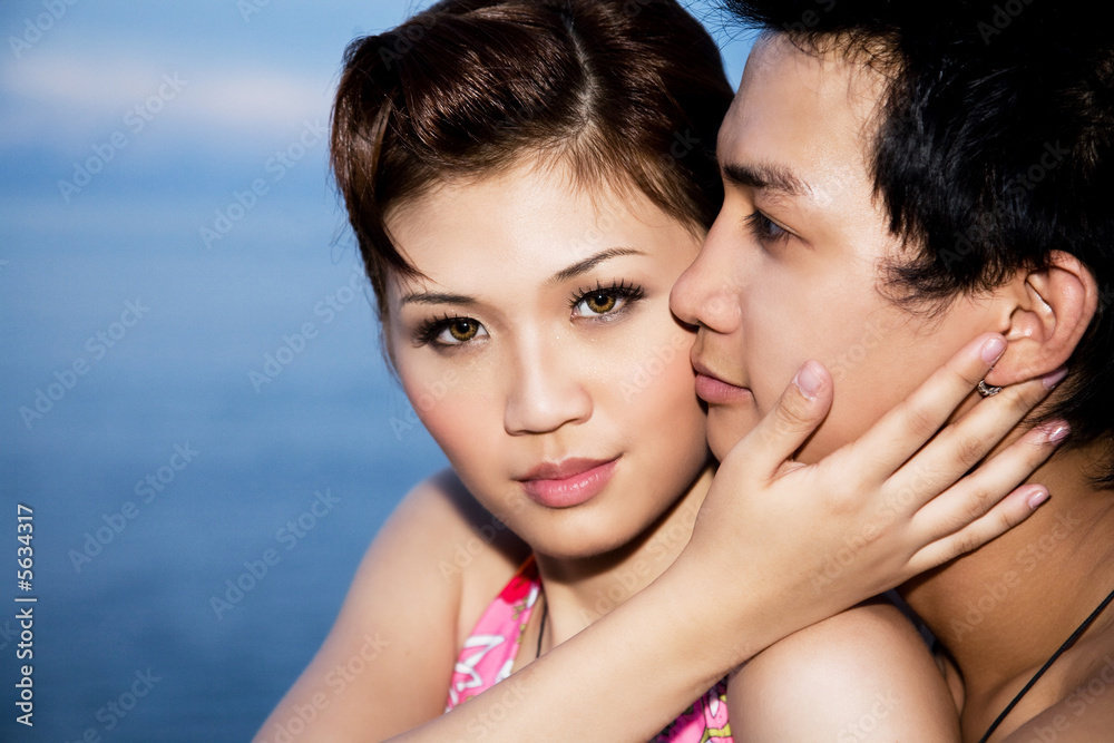 loving couple with the girl facing camera loving couple with the girl facing camera