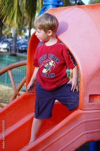 Boy on a Playground Slide