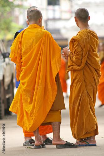 Buddhist monks in the grounds of a temple in Thailand