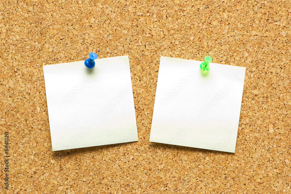 Yellow post it notes on the corkboard Yellow post it notes on the corkboard