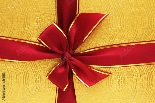 Close up of the gift box with red ribbon