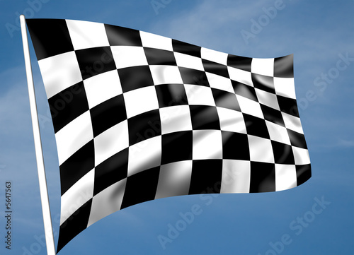 Rippled black and white chequered flag with sky background