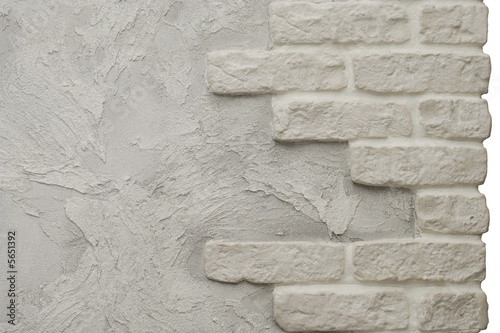 Fragment of creative stucco with bricks