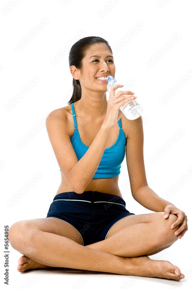 An attractive mixed-race woman in blue sportswear sitting An attractive mixed-race woman in blue sportswear sitting