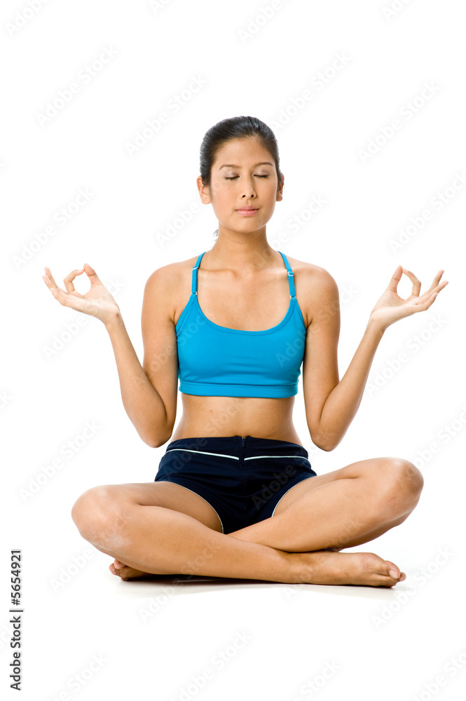 A young woman in sportswear sitting on the floor of studio A young woman in sportswear sitting on the floor of studio