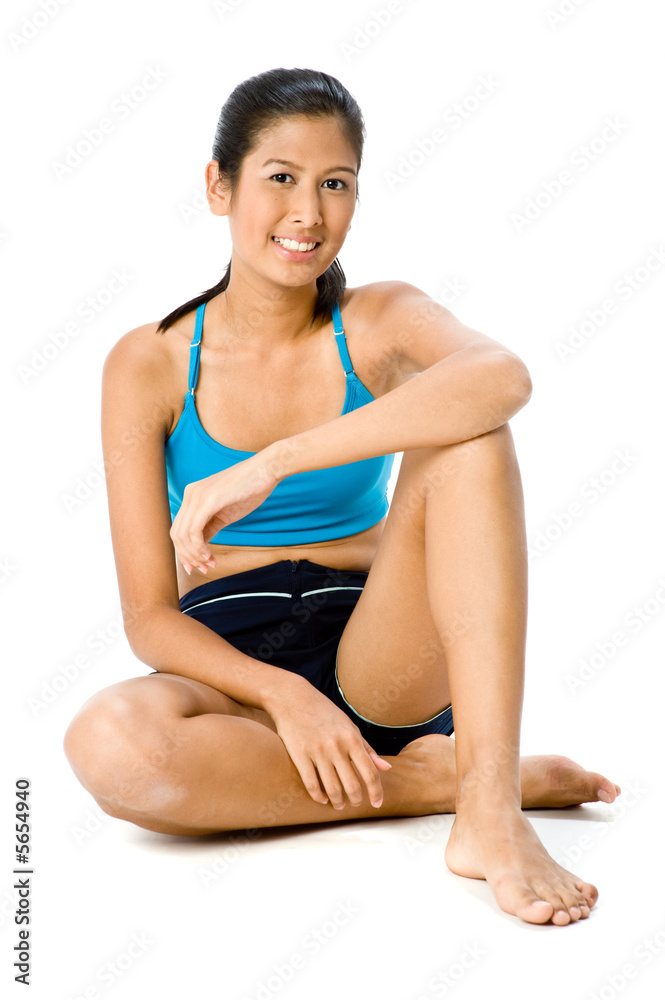 A beautiful Asian woman in sportswear on white background A beautiful Asian woman in sportswear on white background