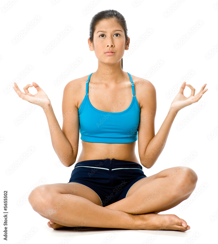 A young woman in sportswear sitting on the floor A young woman in sportswear sitting on the floor