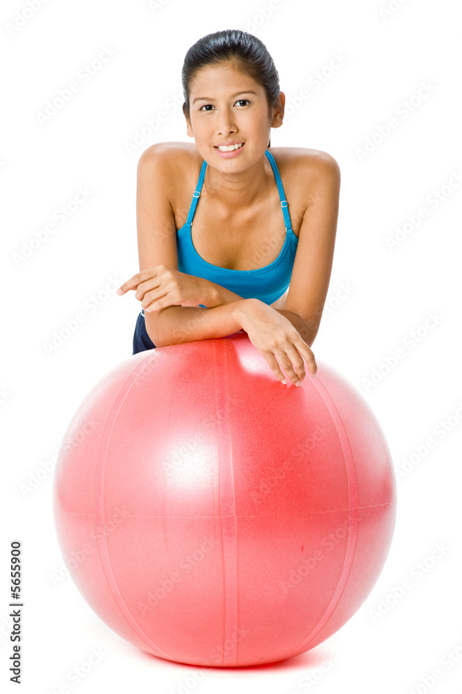 An attractive young Asian woman resting on fitball An attractive young Asian woman resting on fitball