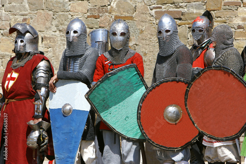 Εκτύπωση καμβά several knights on stone wall background