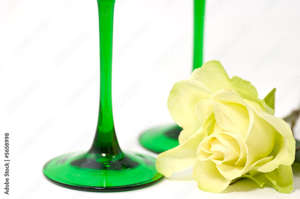 Yellow rose and green glasses