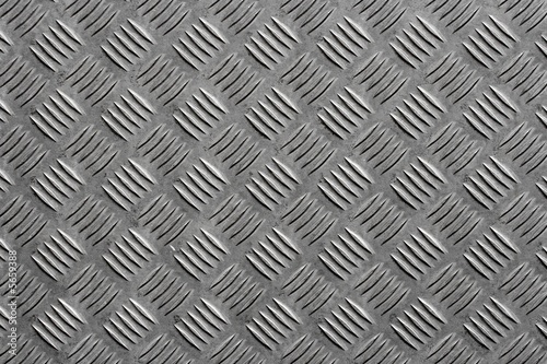 Grey metal surface with a bumpy pattern