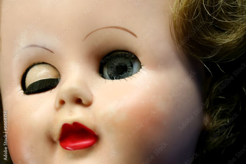 Close up of a doll face with one eye closed Stock Photo | Adobe Stock
