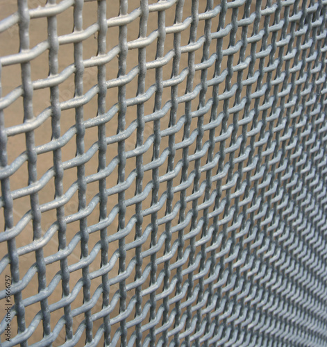 Wire mesh fencing material vanishing into the corner 